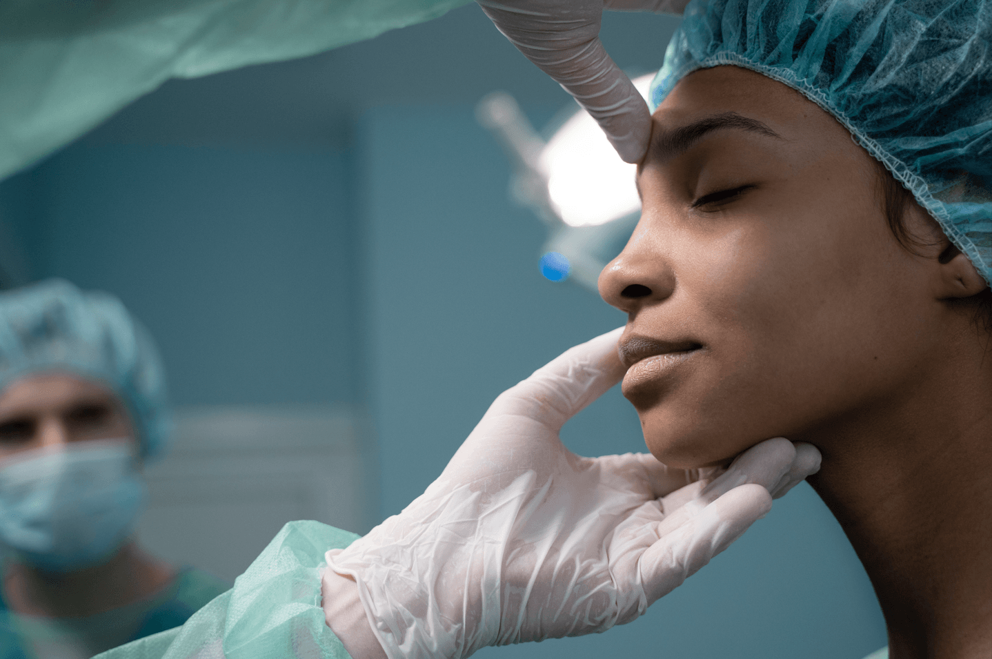 nurse getting prepared before rhinoplasty procedure