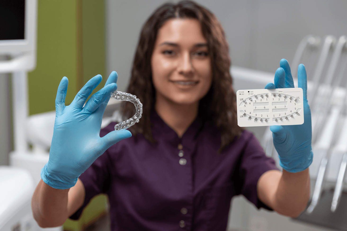 woman comparing clear aligners to tradicional braces
