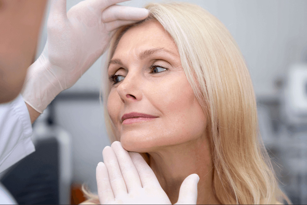 woman deciding between facelift vs non-surgical