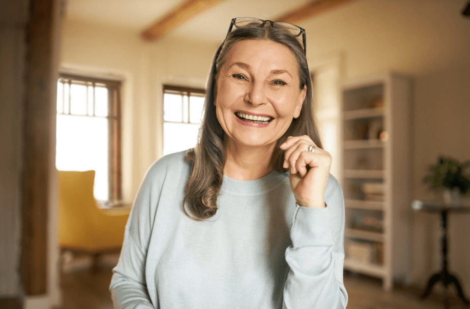 woman smiling as an a example of who needs all-on-6 procedure